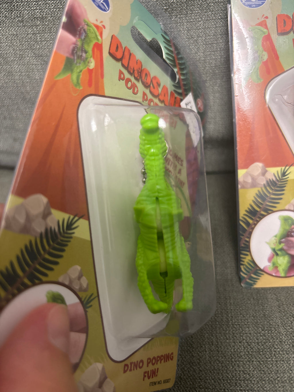 Dinosaur pea pod popper keychain